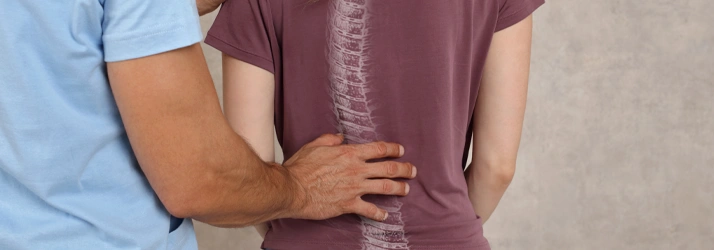 Hands-on assessment of the spine highlighting neck and back pain care